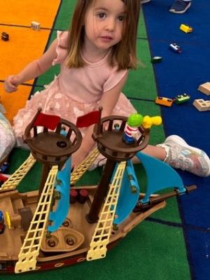 Sandra playing at school with toy purchased with donated funds form last year's walk..